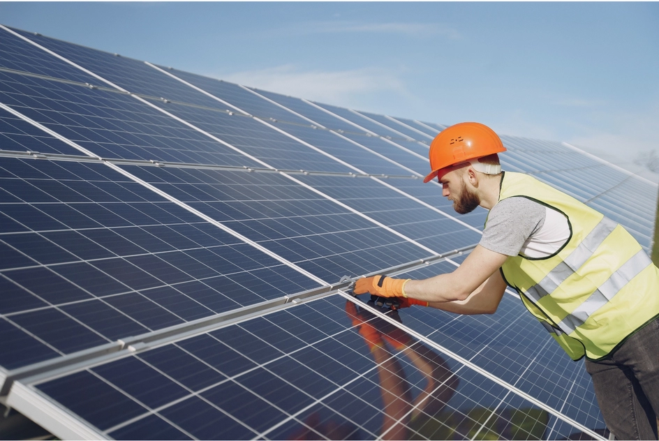 Commercial solar panel installation on a building rooftop.